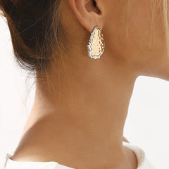 textured oval stud earrings with irregular edge trim - ALMAV