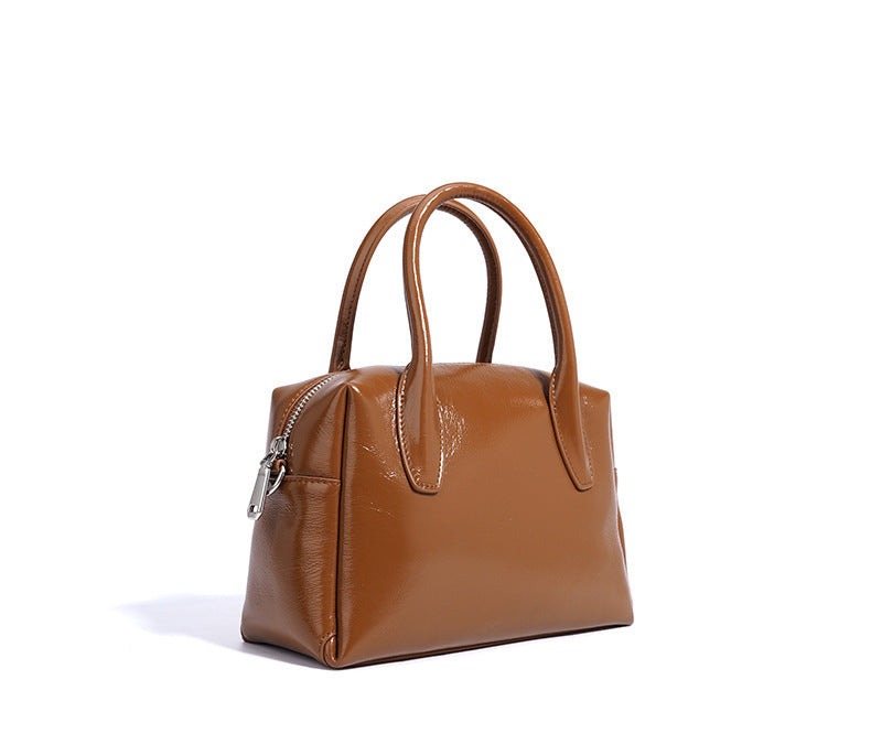 structured mini handbag with knotted charm - DELKA