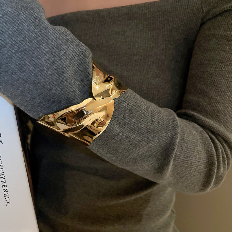 sculptural gold wide cuff bracelet with fluid contours – ARYO