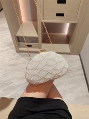 Pearl-embellished clutch with gold clasp - Ikliru