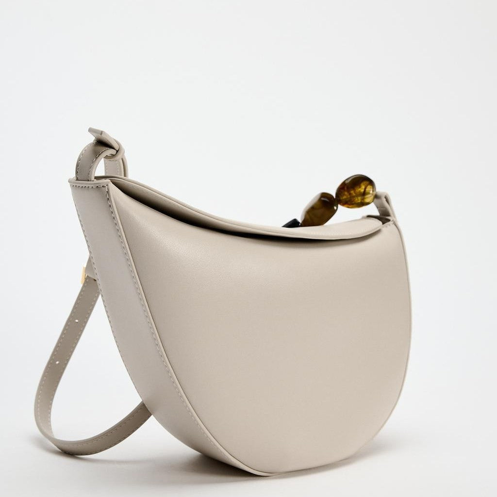 crescent-shaped shoulder bag with resin bead detail – ONRA