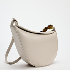 crescent-shaped shoulder bag with resin bead detail – ONRA