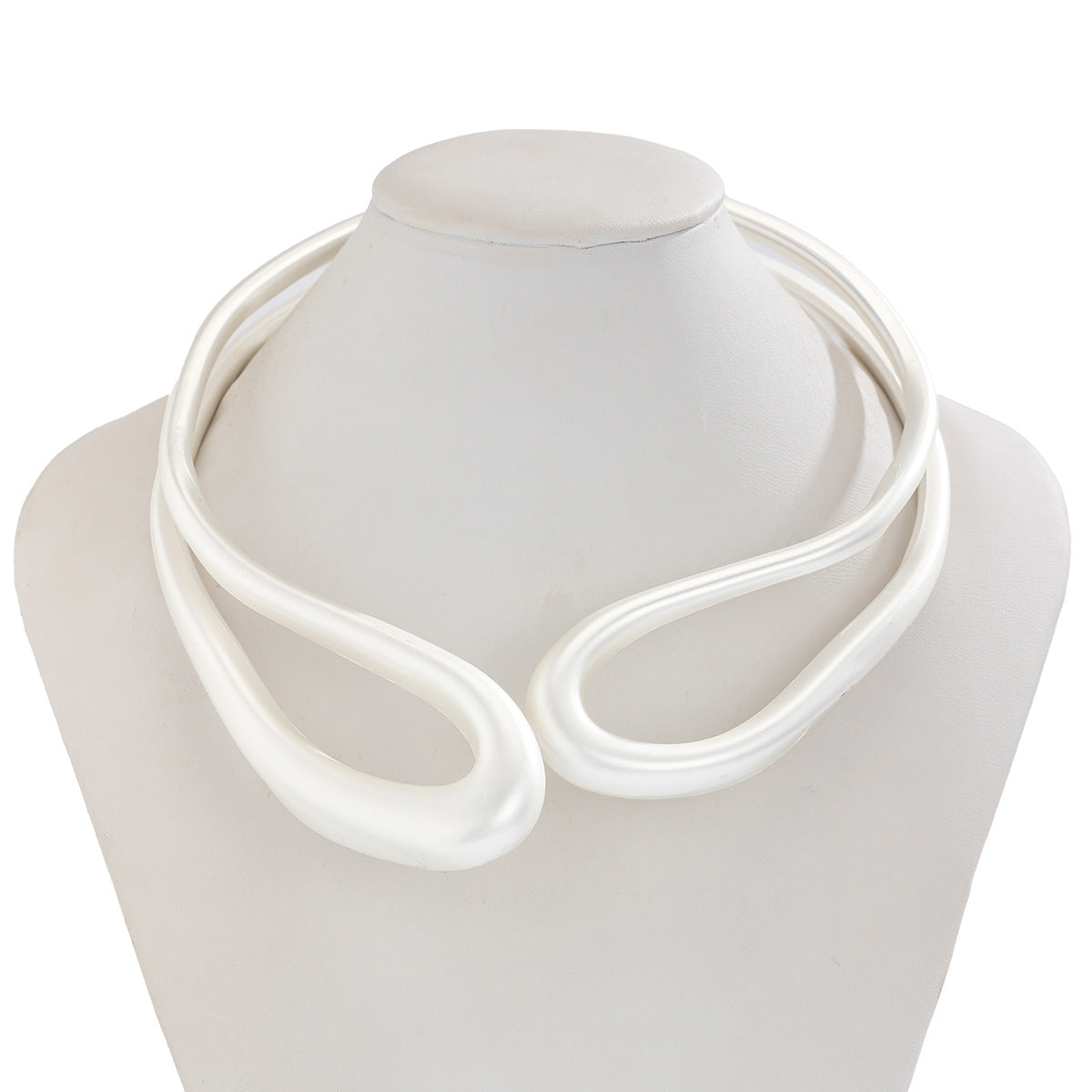 Twisted open metal choker with sculptural wave design - Dolkia