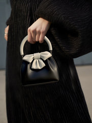 Bow-embellished handbag with round handle - Sikry