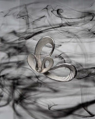 Sculptural looped earrings with layered ribbon texture - Irlino