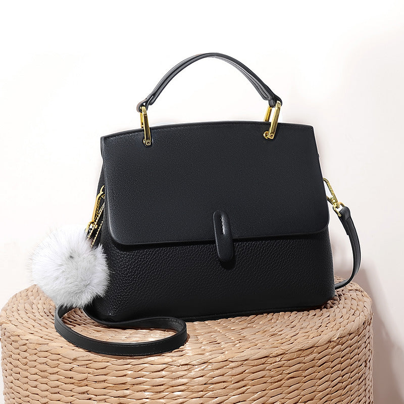 Structured handbag with gold hardware and pompom accent - Lilsy