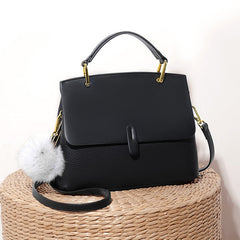 Structured handbag with gold hardware and pompom accent - Lilsy
