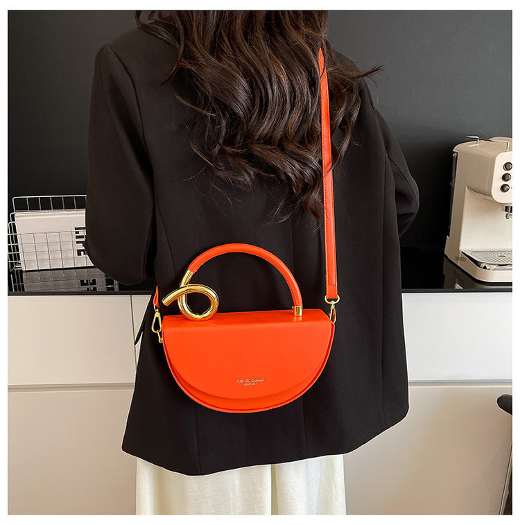 half-moon leather handbag with gold spiral handle – ORENA