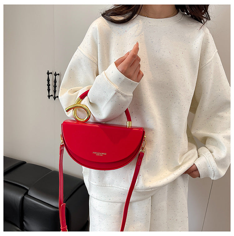 half-moon leather handbag with gold spiral handle – ORENA