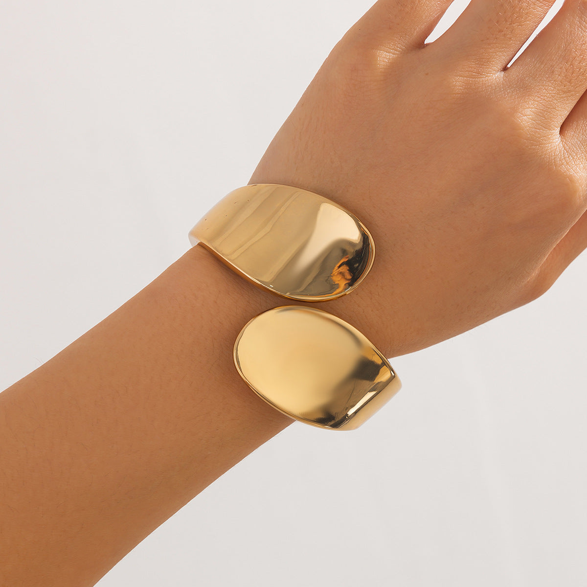 smooth gold cuff bracelet with curved teardrop ends – SOLA