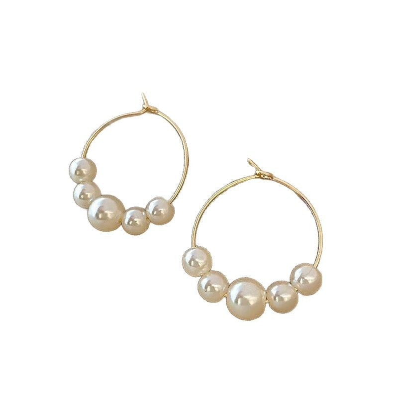 gold hoop earrings with graduated pearls – SENA