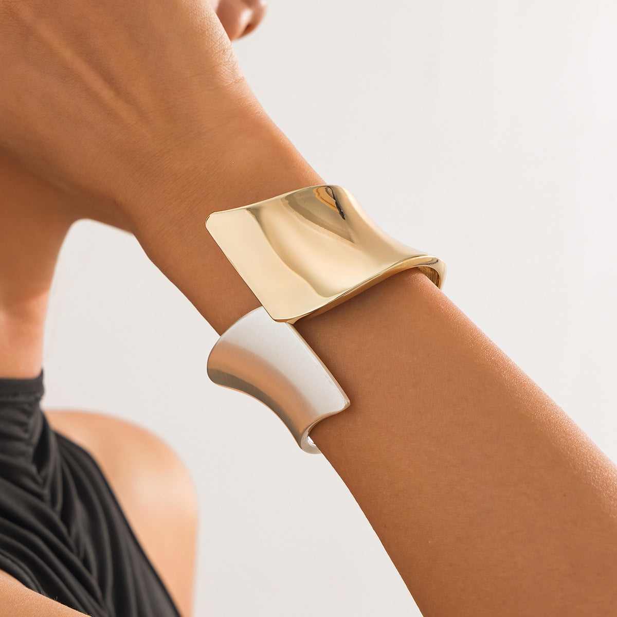 Two-tone wide cuff bracelet with sculptural twist - Nesdu