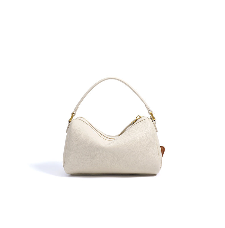 curved shoulder bag with contrast charm detail – MIIRA
