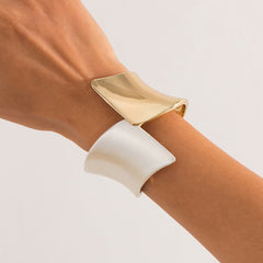 Two-tone wide cuff bracelet with sculptural twist - Nesdu