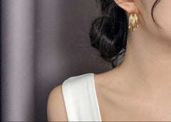 Triple hoop drop earrings in polished gold-tone finish - Arma