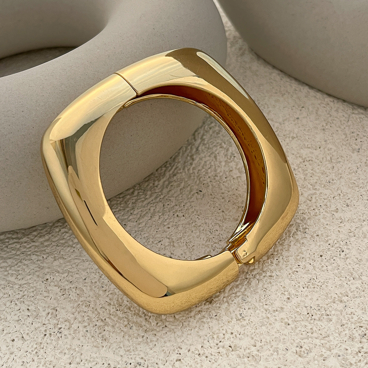 wide sculpted cuff bracelet in high-shine gold – NOVARA