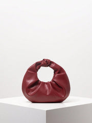 Knotted circular handbag in soft faux leather - Runda