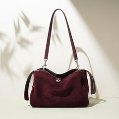 suede shoulder bag with curved zipper detail – TERRA
