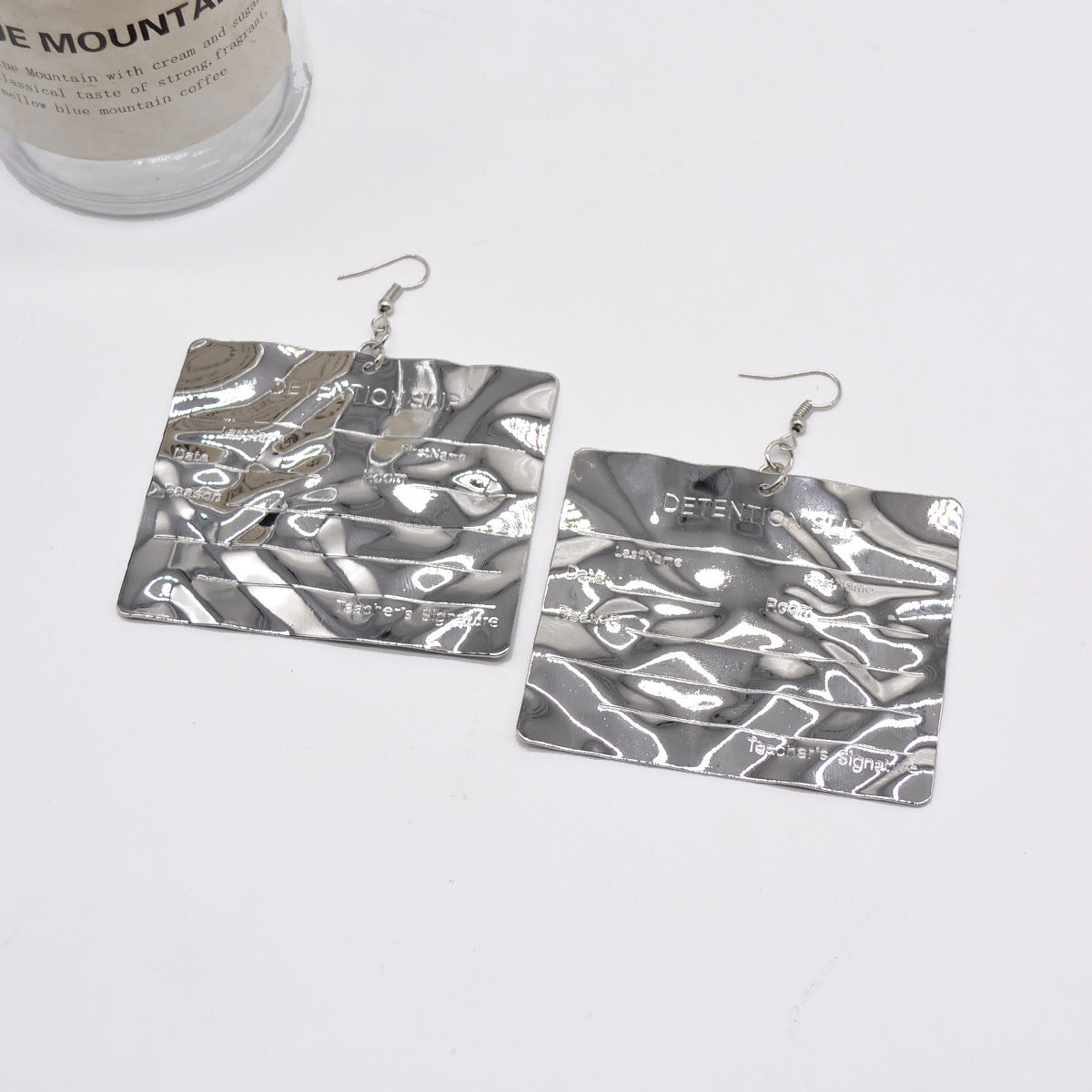 Engraved metallic statement earrings with hammered texture - Lanai