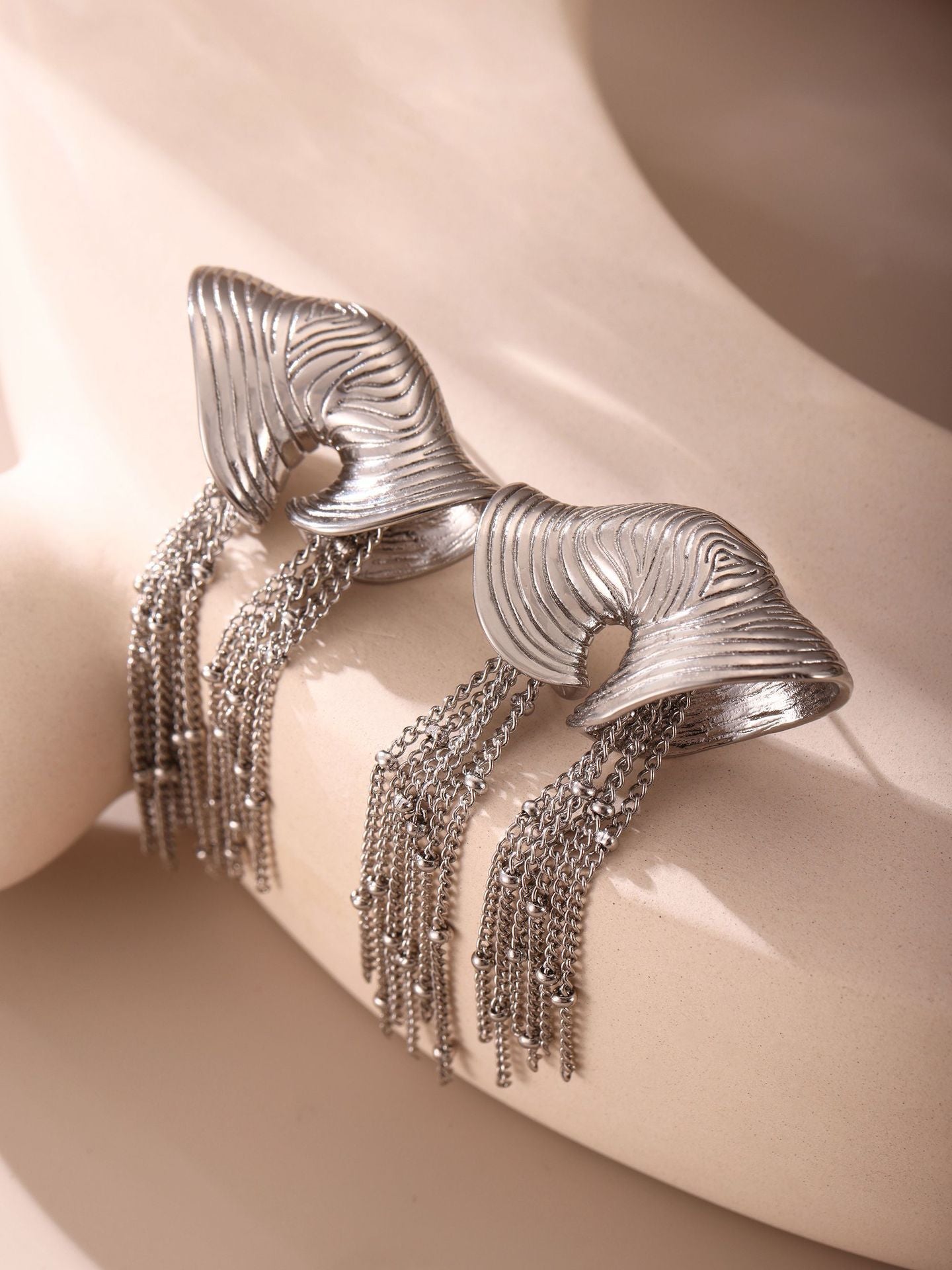 sculpted gold fan earrings with cascading chain tassels – VALINA