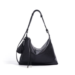 slouchy leather shoulder bag with minimalist charm – NOVIR