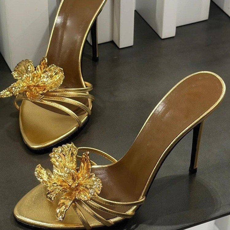 black stiletto mules with gold sculpted flower – CALISTA