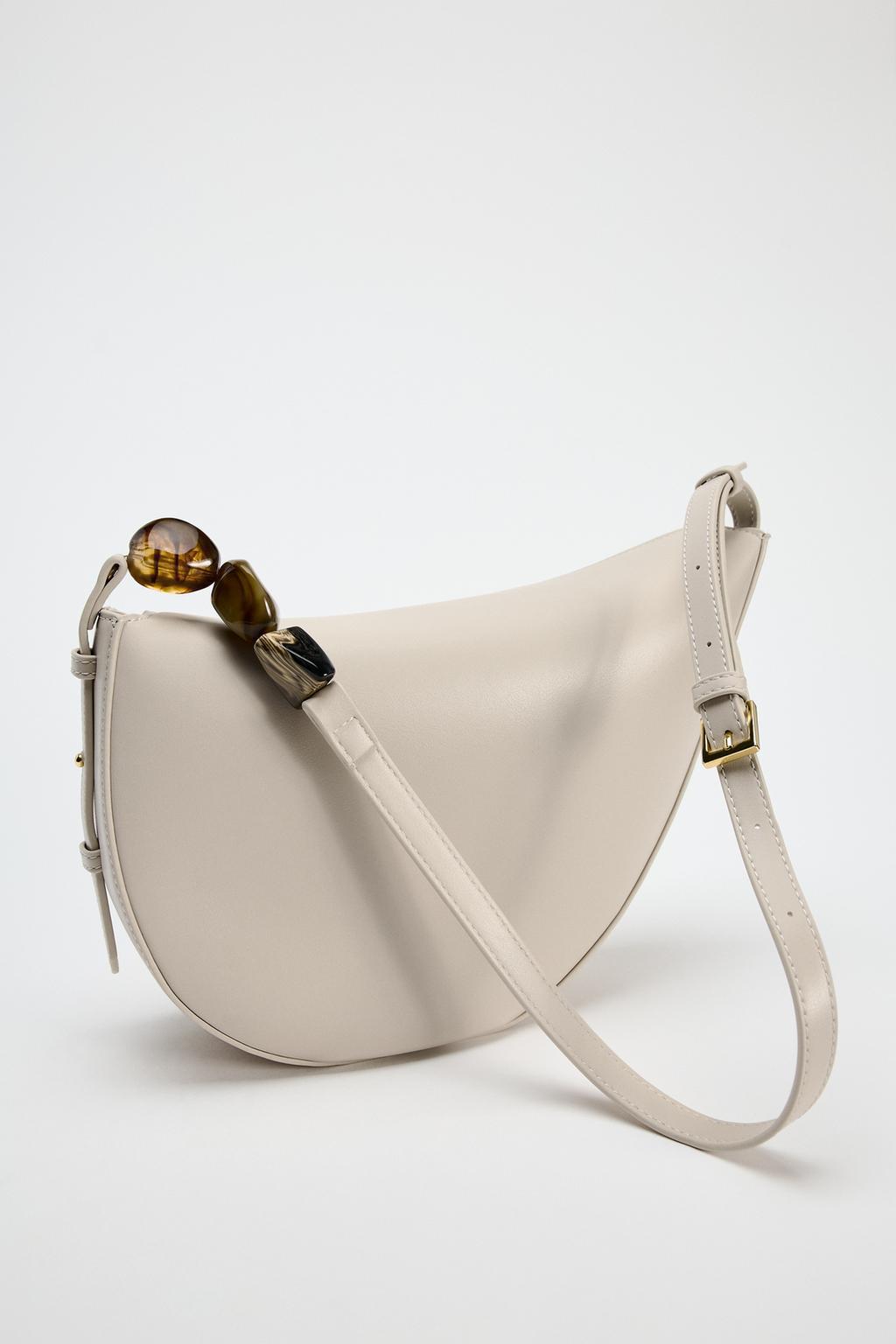 crescent-shaped shoulder bag with resin bead detail – ONRA