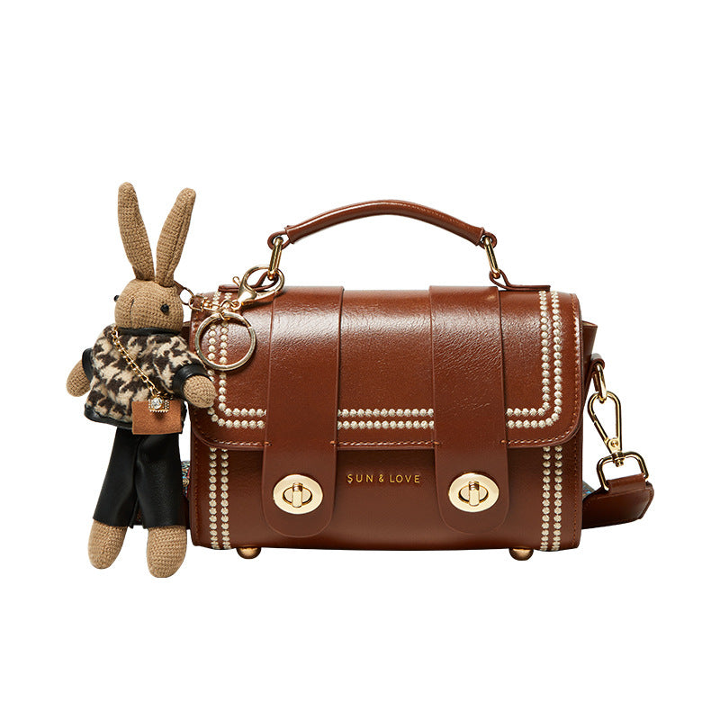 pearl-trim leather satchel with double clasp & bunny charm – COCOA