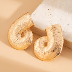 Sculptural spiral stud earrings with glossy texture - Vrtoni