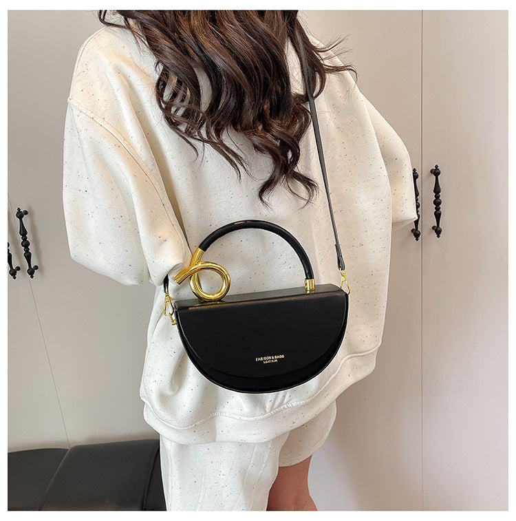 half-moon leather handbag with gold spiral handle – ORENA