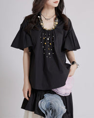 Short-sleeve blouse with decorative floral details - Buggri