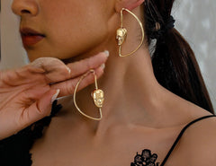 Gold abstract face earrings with geometric hoop frame - Avra