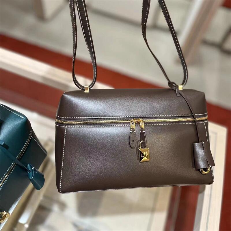 structured leather crossbody with gold lock detail – VERA