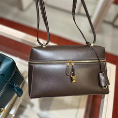 structured leather crossbody with gold lock detail – VERA