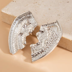 Abstract face silhouette stud earrings with curved edges - Nilga
