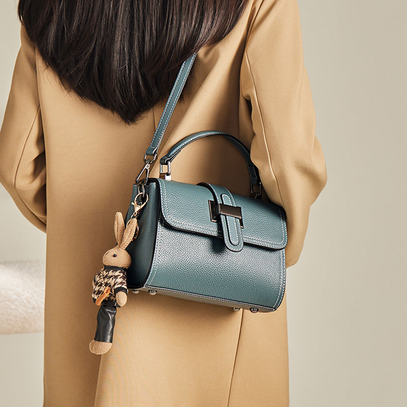 boxy leather handbag with buckle strap & bunny charm – TEAL