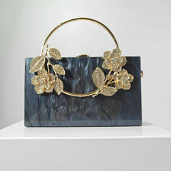 Geometric structured clutch with floral embellishments - Hirlu