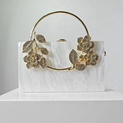 Geometric structured clutch with floral embellishments - Hirlu