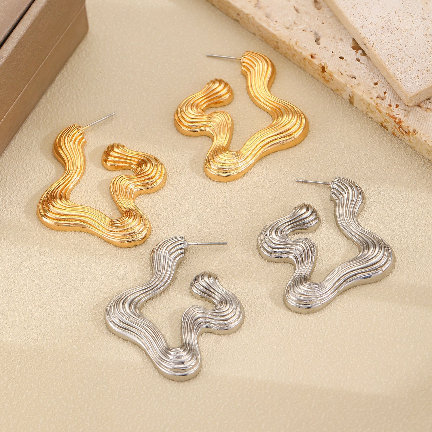 Ribbed abstract wave earrings with sculptural curves - Vasdy