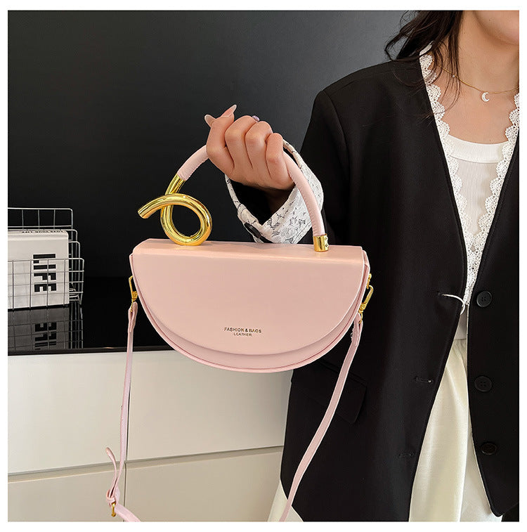 half-moon leather handbag with gold spiral handle – ORENA