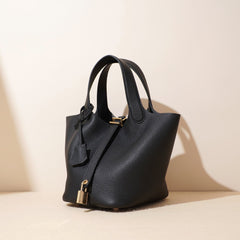 pebbled leather bucket bag with gold padlock – NOA