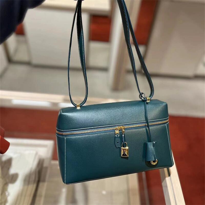 structured leather crossbody with gold lock detail – VERA