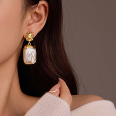 gold-framed irregular pearl drop earring – CELINE