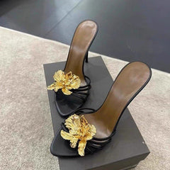 black stiletto mules with gold sculpted flower – CALISTA