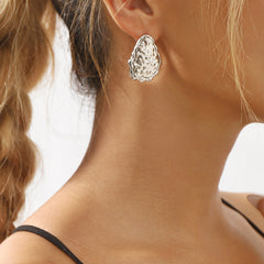 textured oval stud earrings with irregular edge trim - ALMAV