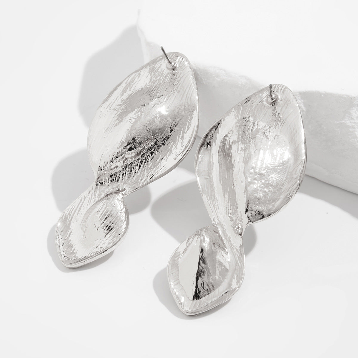 Textured leaf drop earrings with organic twist - Azina