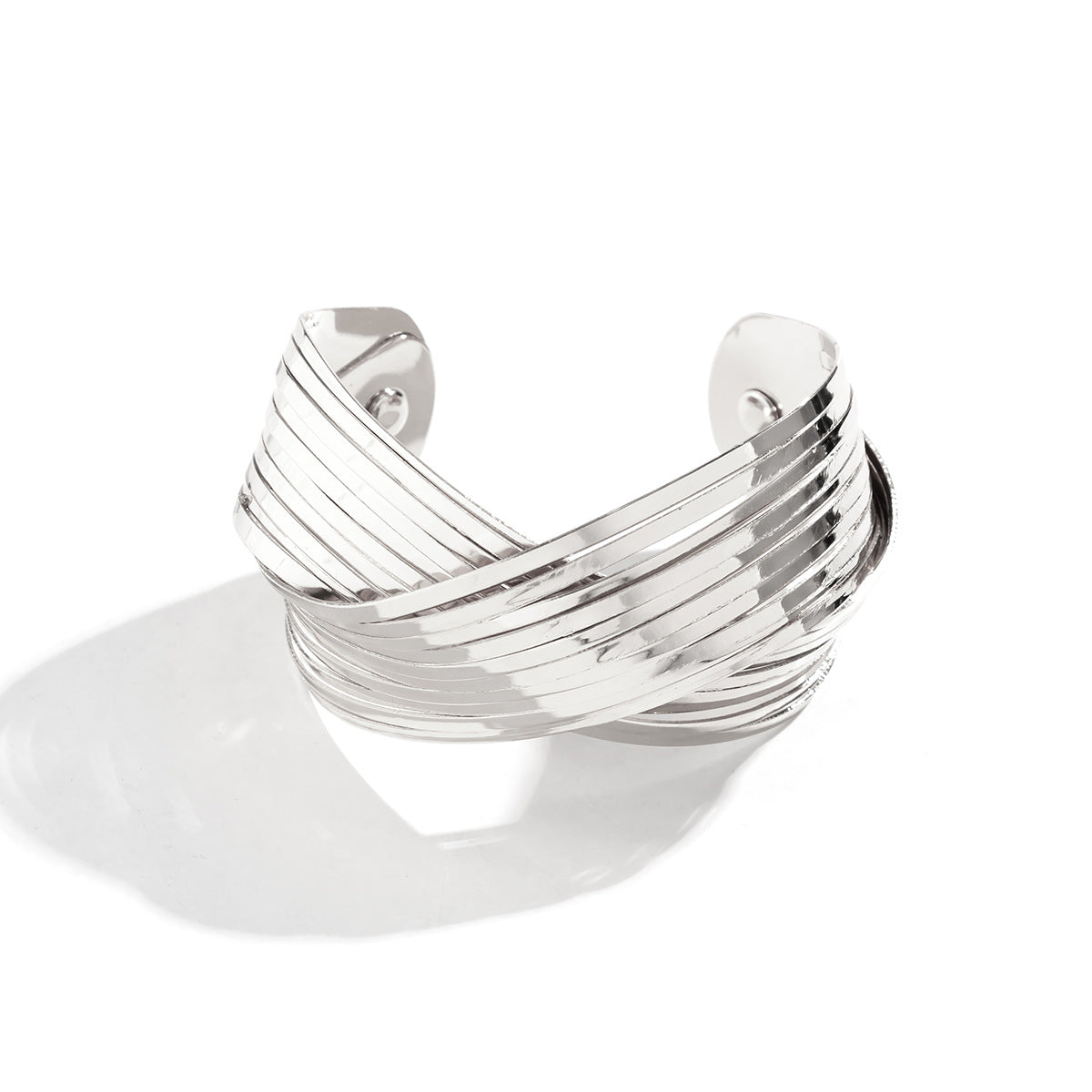 layered gold cuff bracelet with twisted band design – SEREIA