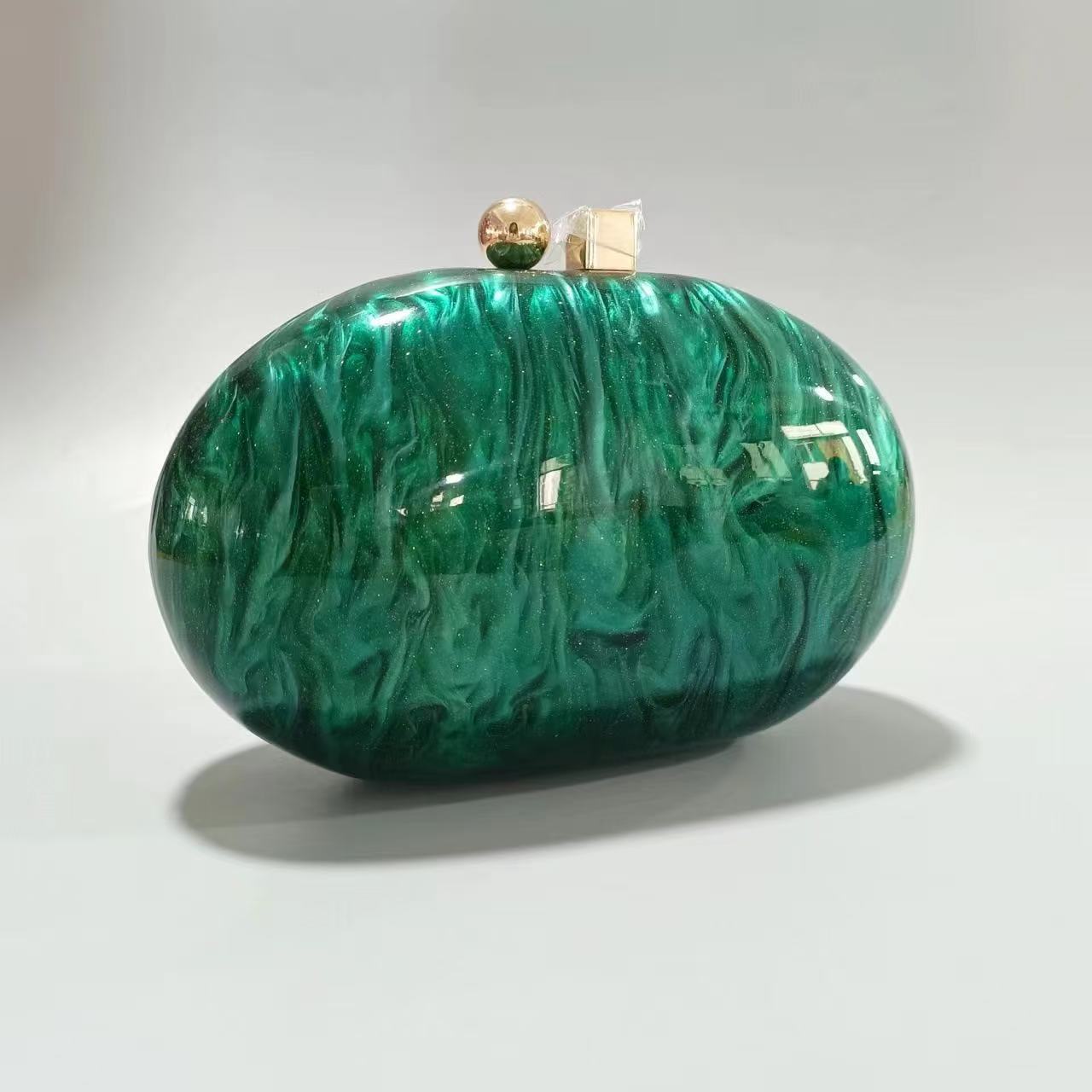 Oval marble clutch with gold clasp and chain handle - Zigru