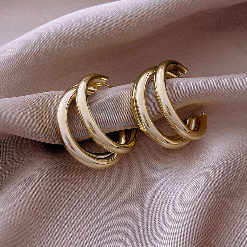 Triple hoop drop earrings in polished gold-tone finish - Arma