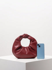 Knotted circular handbag in soft faux leather - Runda